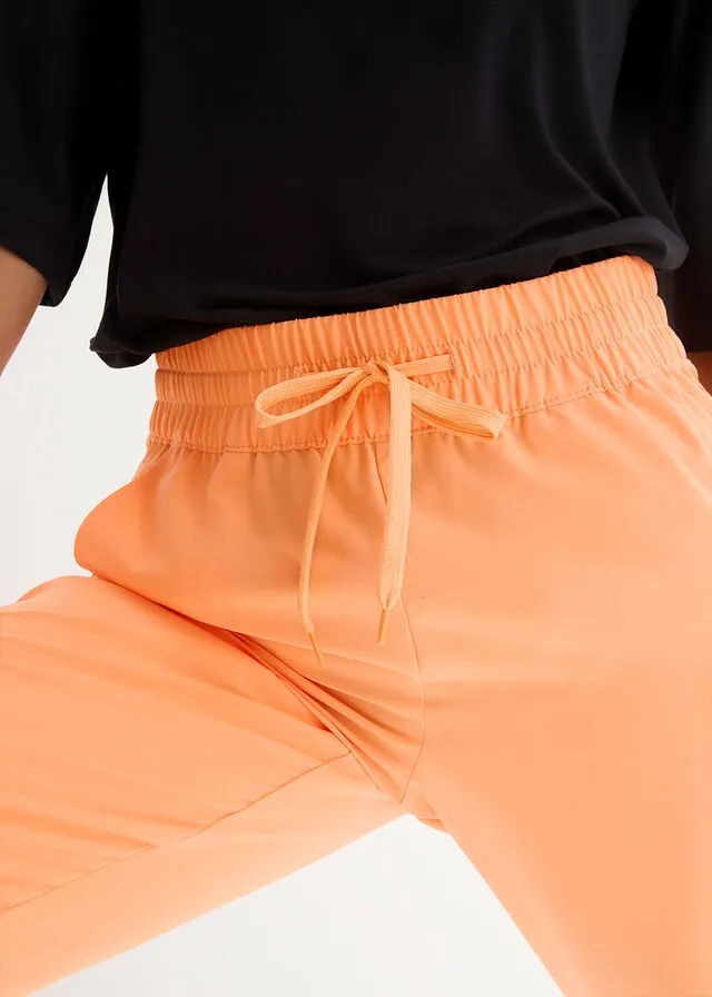 Pantalón funcional de largo capri y secado rápido Naranja claro